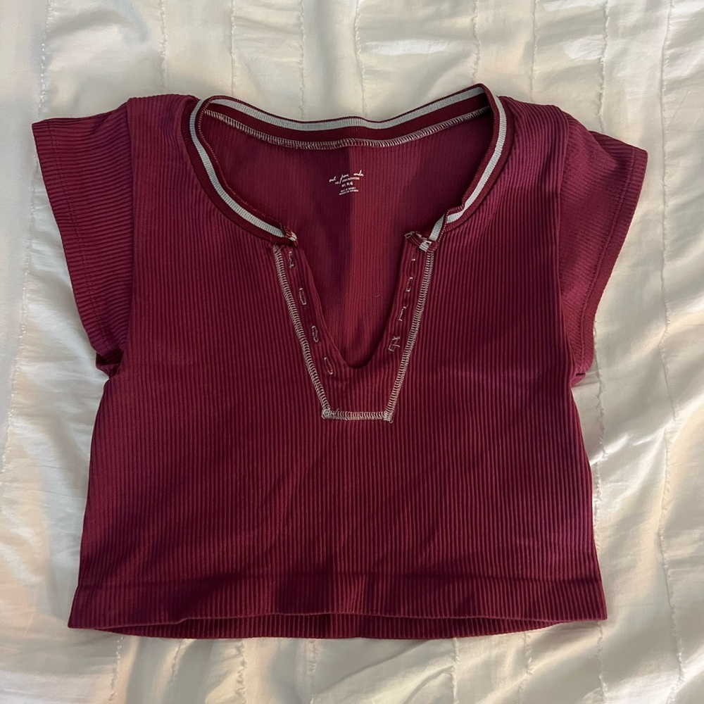 Urban Outfitters out from under tee shirt